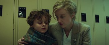 Movie still from “The Kindness of Strangers” (2019), directed by Lone Scherfig – A woman and a child are looking at each other; Close Up shot, Low angle