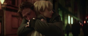 Movie still from “The Kindness of Strangers” (2019), directed by Lone Scherfig – A man and a woman hugging each other; Close Up shot, Low angle