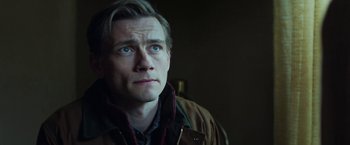 Movie still from “The Kindness of Strangers” (2019), directed by Lone Scherfig – A person wearing a jacket; Close Up shot, Low angle