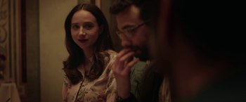 Movie still from “The Kindness of Strangers” (2019), directed by Lone Scherfig – A woman and a man sitting next to each other in a room; Close Up shot, Over the shoulder angle