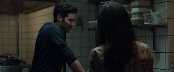 Movie still from “The Kindness of Strangers” (2019), directed by Lone Scherfig – A man and a woman in a bathroom; Medium shot, Over the shoulder angle