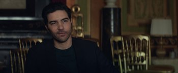 Movie still from “The Kindness of Strangers” (2019), directed by Lone Scherfig – A person sitting in a room; Close Up shot, Over the shoulder angle