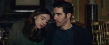 Movie still from “The Kindness of Strangers” (2019), directed by Lone Scherfig – A man and a woman sitting next to each other; Close Up shot, Over the shoulder angle