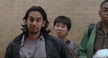 Movie still from “Good Will Hunting” (1997), directed by Gus Van Sant – A group of people standing next to a brick wall; Close Up shot, Over the shoulder angle