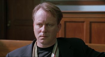 Movie still from “Good Will Hunting” (1997), directed by Gus Van Sant – A person sitting in a chair; Close Up shot, Over the shoulder angle