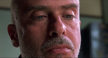 Movie still from “Good Will Hunting” (1997), directed by Gus Van Sant – A man's face with a beard; Extreme Close Up shot, Low angle