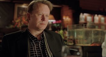 Movie still from “Good Will Hunting” (1997), directed by Gus Van Sant – A person wearing a suit and tie; Close Up shot, Over the shoulder angle