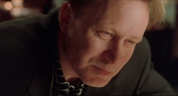 Movie still from “Good Will Hunting” (1997), directed by Gus Van Sant – A person wearing a suit and tie; Close Up shot, Low angle