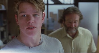Movie still from “Good Will Hunting” (1997), directed by Gus Van Sant – A man and a boy standing next to each other in a room; Close Up shot, Low angle