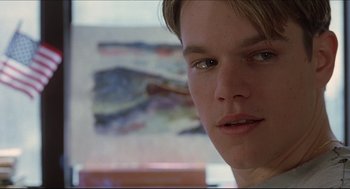 Movie still from “Good Will Hunting” (1997), directed by Gus Van Sant – A person with a painting in the background; Close Up shot, Low angle