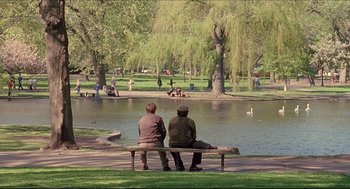 Movie still from “Good Will Hunting” (1997), directed by Gus Van Sant – Two people sitting on a bench in a park; Wide shot, Over the shoulder angle