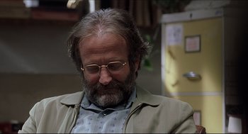 Movie still from “Good Will Hunting” (1997), directed by Gus Van Sant – A person wearing glasses and a jacket; Close Up shot, Over the shoulder angle