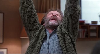 Movie still from “Good Will Hunting” (1997), directed by Gus Van Sant – An older man with a beard and a sweater hanging from a tree; Close Up shot, Overhead angle