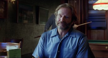 Movie still from “Good Will Hunting” (1997), directed by Gus Van Sant – A man in a blue shirt is looking at the camera; Close Up shot, Over the shoulder angle