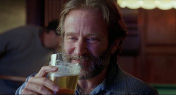 Movie still from “Good Will Hunting” (1997), directed by Gus Van Sant – A person holding a glass of beer; Close Up shot, Low angle