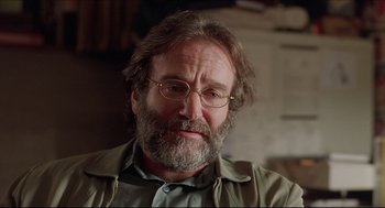 Movie still from “Good Will Hunting” (1997), directed by Gus Van Sant – An older man wearing glasses and a green shirt; Close Up shot, Over the shoulder angle