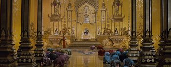 Movie still from “The King and I” (1956), directed by Walter Lang – A group of people kneeling down in front of a priest; Extreme Wide shot, High angle