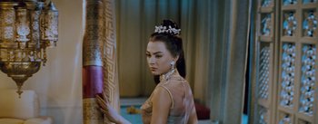 Movie still from “The King and I” (1956), directed by Walter Lang – A beautiful woman in a white dress and a tiara; Medium shot, Over the shoulder angle