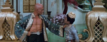 Movie still from “The King and I” (1956), directed by Walter Lang – A man and a boy are dressed in oriental garb; Medium shot, Over the shoulder angle
