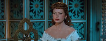 Movie still from “The King and I” (1956), directed by Walter Lang – A wax figure of a woman in a white dress; Close Up shot, Over the shoulder angle