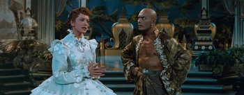 Movie still from “The King and I” (1956), directed by Walter Lang – A man and a woman are talking to each other; Medium shot, Over the shoulder angle