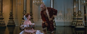 Movie still from “The King and I” (1956), directed by Walter Lang – A man and a woman are dancing on a stage; Medium shot, High angle