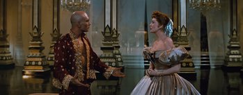 Movie still from “The King and I” (1956), directed by Walter Lang – A man and a woman are talking to each other; Medium shot, Over the shoulder angle