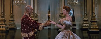Movie still from “The King and I” (1956), directed by Walter Lang – A man and a woman dressed in renaissance clothing; Medium shot, Low angle