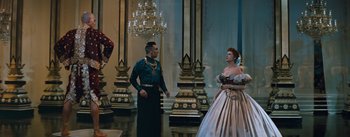 Movie still from “The King and I” (1956), directed by Walter Lang – A man and a woman dressed in medieval clothing; Wide shot, Low angle