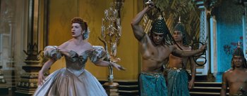 Movie still from “The King and I” (1956), directed by Walter Lang – A man and a woman are performing a dance; Medium shot, Low angle