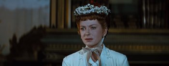 Movie still from “The King and I” (1956), directed by Walter Lang – A person wearing a hat; Close Up shot, Over the shoulder angle