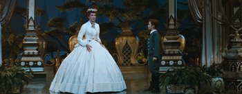 Movie still from “The King and I” (1956), directed by Walter Lang – A man and a woman dressed in period clothing; Wide shot, Low angle