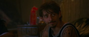 Movie still from “The King of Staten Island” (2020), directed by Judd Apatow – A person wearing a tank top; Close Up shot, Over the shoulder angle
