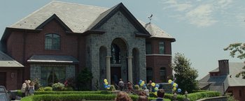 Movie still from “The King of Staten Island” (2020), directed by Judd Apatow – A group of people standing in front of a building; Extreme Wide shot, Low angle