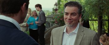 Movie still from “The King of Staten Island” (2020), directed by Judd Apatow – A person wearing a suit and tie; Close Up shot, Over the shoulder angle
