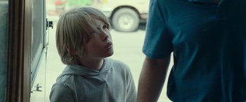 Movie still from “The King of Staten Island” (2020), directed by Judd Apatow – A young boy is looking up at a man; Close Up shot, Over the shoulder angle