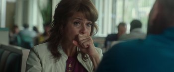 Movie still from “The King of Staten Island” (2020), directed by Judd Apatow – A person sitting at a table holding her hand to her mouth; Close Up shot, Over the shoulder angle