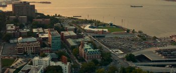 Movie still from “The King of Staten Island” (2020), directed by Judd Apatow – An aerial view of a city with a lake in the background; Extreme Wide shot, High angle