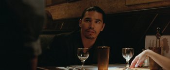 Movie still from “The King of Staten Island” (2020), directed by Judd Apatow – A man sitting at a table in front of a wine glass; Close Up shot, Over the shoulder angle