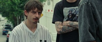 Movie still from “The King of Staten Island” (2020), directed by Judd Apatow – Two men standing next to each other with tattoos on their arms; Close Up shot, Low angle