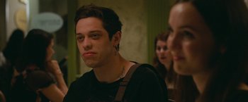 Movie still from “The King of Staten Island” (2020), directed by Judd Apatow – A man with a tattoo on his neck and chest; Close Up shot, Over the shoulder angle