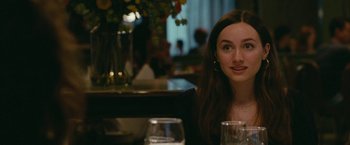 Movie still from “The King of Staten Island” (2020), directed by Judd Apatow – A woman sitting at a table with a glass of wine; Close Up shot, Over the shoulder angle