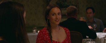 Movie still from “The King of Staten Island” (2020), directed by Judd Apatow – A beautiful young lady wearing a red dress; Close Up shot, Over the shoulder angle