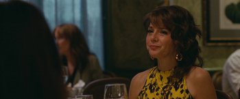 Movie still from “The King of Staten Island” (2020), directed by Judd Apatow – A woman sitting at a table with a glass of wine in front of her; Close Up shot, Over the shoulder angle