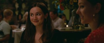 Movie still from “The King of Staten Island” (2020), directed by Judd Apatow – A woman sitting at a table in front of other people; Close Up shot, Over the shoulder angle