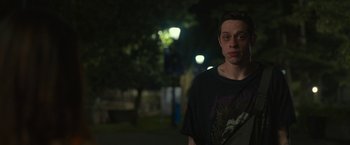 Movie still from “The King of Staten Island” (2020), directed by Judd Apatow – A man standing in the street at night; Medium shot, Over the shoulder angle
