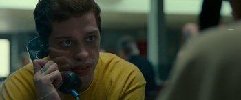 Movie still from “The King of Staten Island” (2020), directed by Judd Apatow – A man sitting in front of a microphone; Close Up shot, Low angle