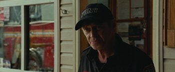 Movie still from “The King of Staten Island” (2020), directed by Judd Apatow – A person wearing a hat; Close Up shot, Over the shoulder angle