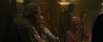 Movie still from “The King of Staten Island” (2020), directed by Judd Apatow – A group of people sitting around a table; Medium shot, Over the shoulder angle