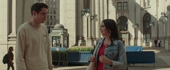 Movie still from “The King of Staten Island” (2020), directed by Judd Apatow – A beautiful young lady walking down the street; Medium shot, Over the shoulder angle